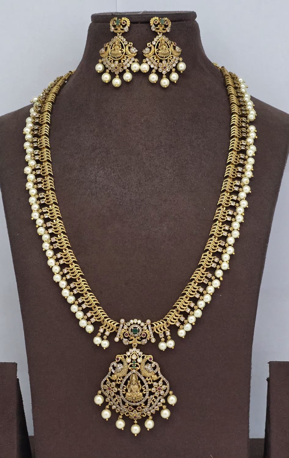 Elegant Antique Gold Temple Lakshmi Long Haram Set with Intricate Mesh Chain, CZ Stones & Pearl Drops (Haram & Earrings Set)